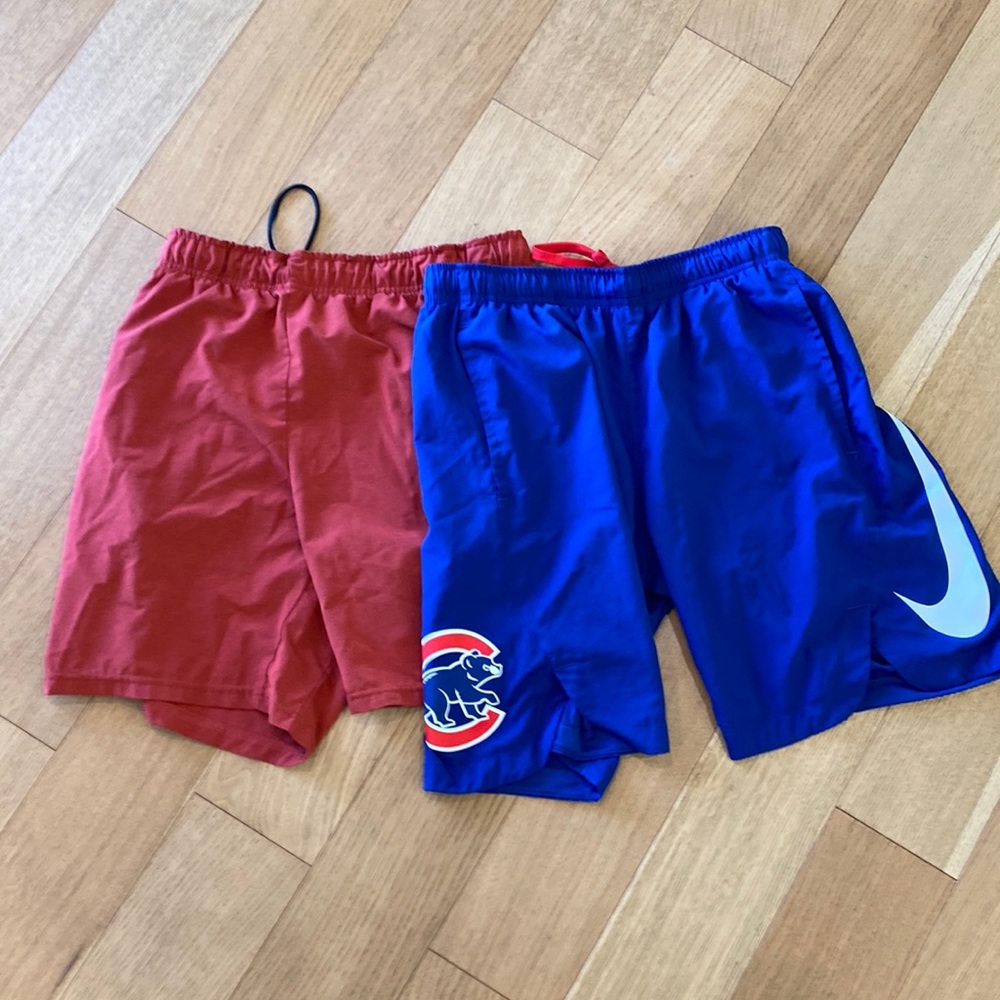 two Nike men’s medium drI-fit shorts - one is Cubs major league baseball (MLB).
